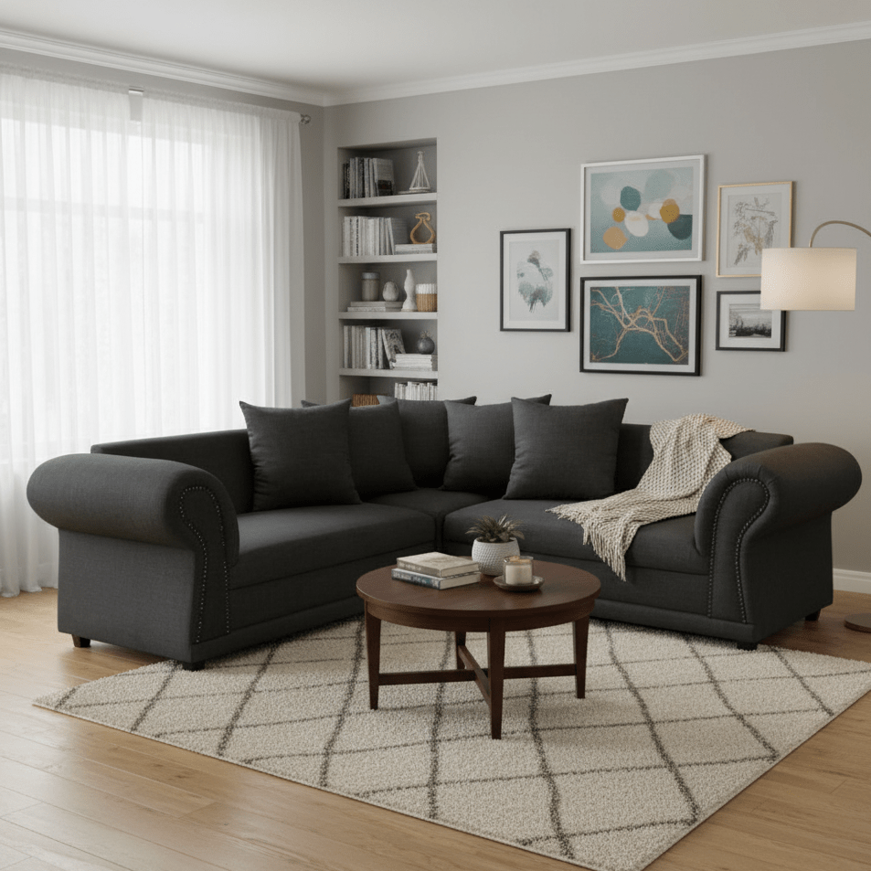 Living room with a gray corner couch sectional sofa, wooden coffee table, and decorative elements.