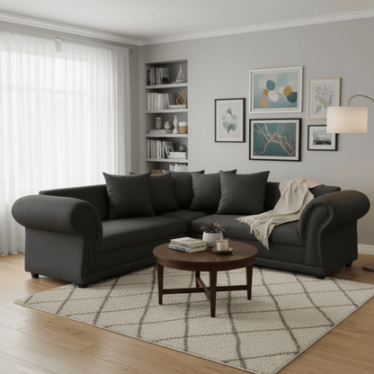 Living room with a gray corner couch sectional sofa, wooden coffee table, and decorative elements.