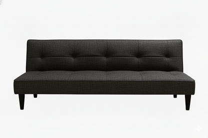 Dark gray sleeper sofa bed with buttoned backrest on a white background That Couch Place